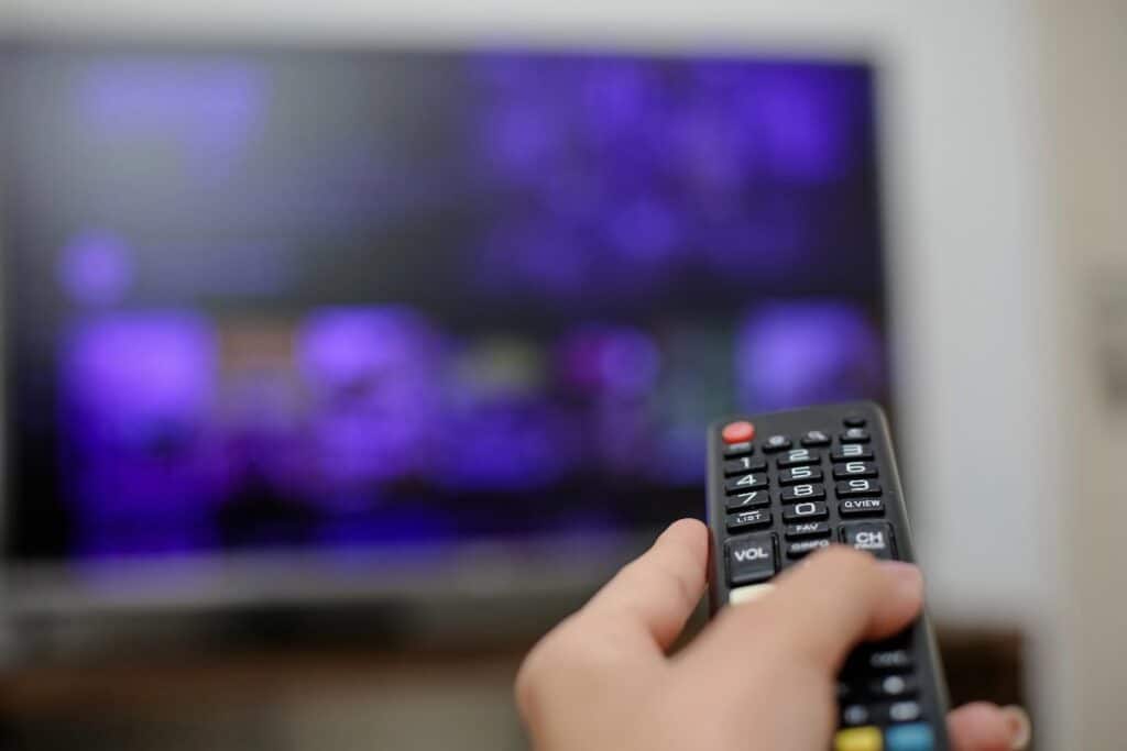 TV remote pointed at screen for ITV soaps schedule 13th to 19th April 2026 and spoilers.